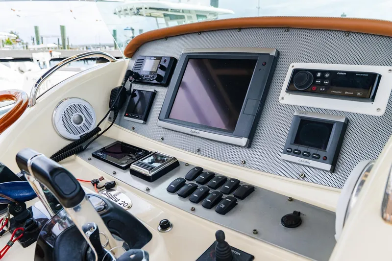 Slide: The Image of Control panel of 2012 Chris-Craft Catalina 29 Sun Tender with navigation and communication equipment. - 25