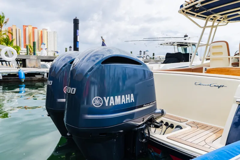 Slide: The Image of 2012 Chris-Craft Catalina 29 Sun Tender with Yamaha engines docked at marina. - 26