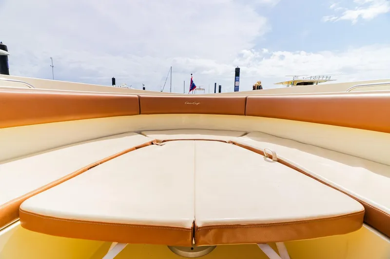 Slide: The Image of 2012 Chris-Craft Catalina 29 Sun Tender boat interior with tan seating and clear sky. - 27
