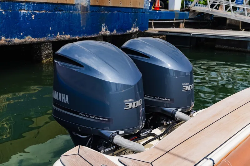 Slide: The Image of Twin Yamaha 300 outboard engines on a 2012 Chris-Craft Catalina 29 Sun Tender boat. - 34