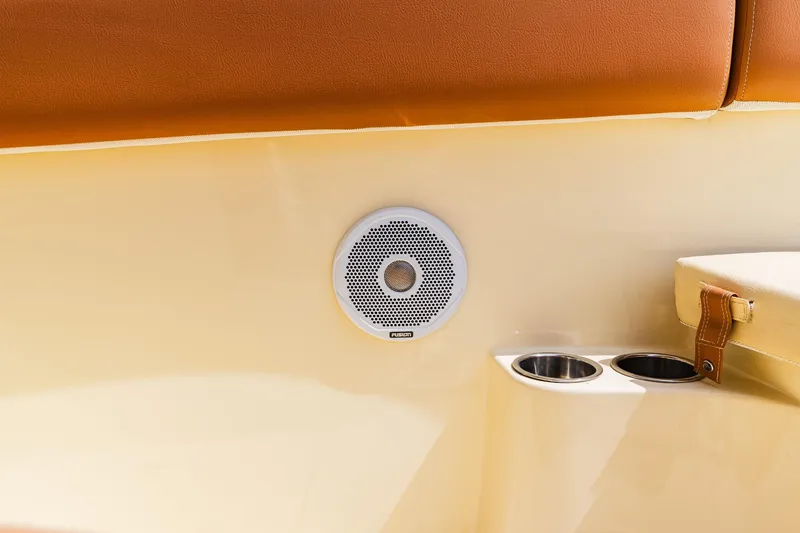 Slide: The Image of Speaker and cup holders on 2012 Chris-Craft Catalina 29 Sun Tender boat interior. - 36