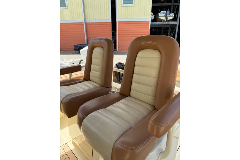 Slide: The Image of Luxurious leather seats on a 2012 Chris-Craft Catalina 29 boat, showcasing comfort and style. - 7