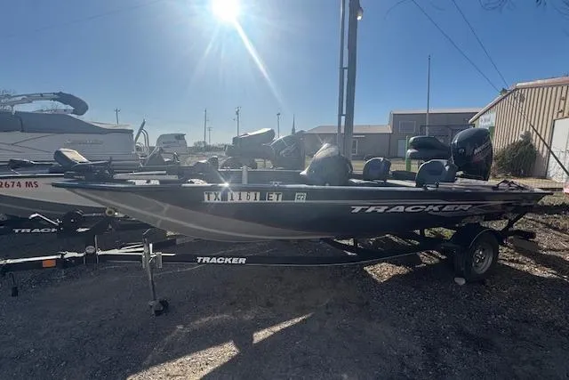 The Image of 2019 Tracker Pro Team 175 TF boat on trailer in outdoor setting. - 1
