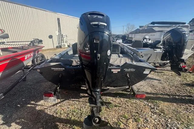 Slide: The Image of 2019 Tracker Pro Team 175 TF boat with outboard motor, parked outdoors. - 3