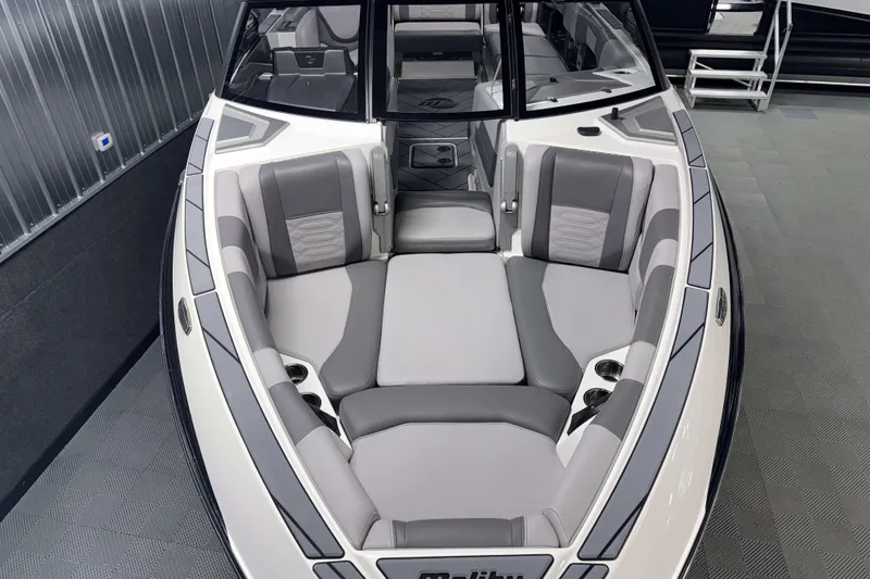 Slide: The Image of 2022 Malibu Wakesetter 25 LSV boat interior with gray and white seating. - 1