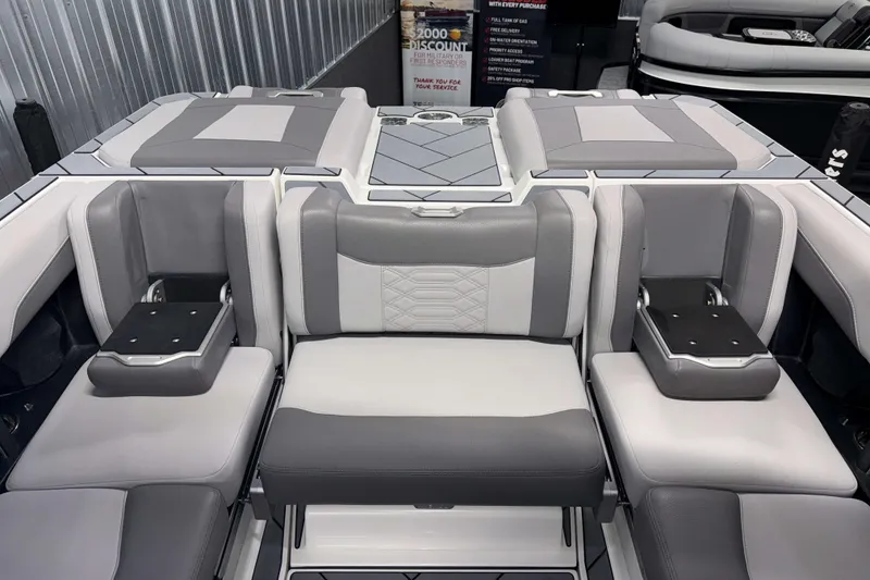 Slide: The Image of 2022 Malibu Wakesetter 25 LSV interior with gray and white seating arrangement. - 11