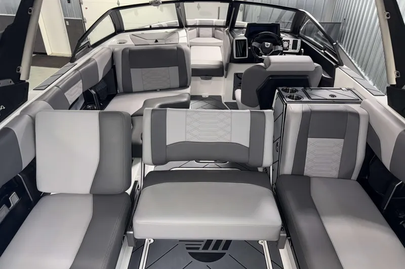 Slide: The Image of 2022 Malibu Wakesetter 25 LSV interior with luxurious gray seating and modern dashboard. - 12
