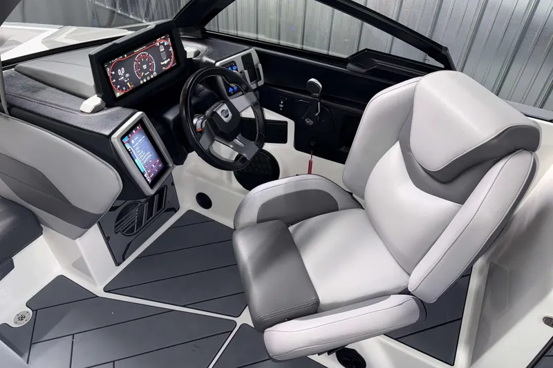 Slide: The Image of 2022 Malibu Wakesetter 25 LSV cockpit with modern dashboard and comfortable seating. - 14