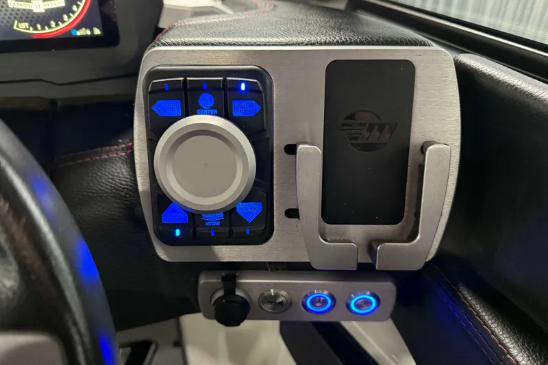 Slide: The Image of Control panel of 2022 Malibu Wakesetter 25 LSV boat with illuminated buttons. - 18