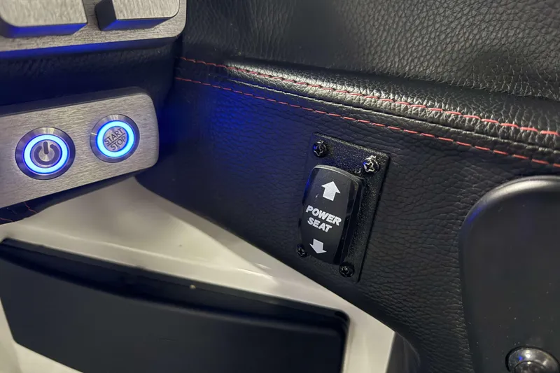 Slide: The Image of 2022 Malibu Wakesetter 25 LSV interior with power seat and start/stop buttons. - 19