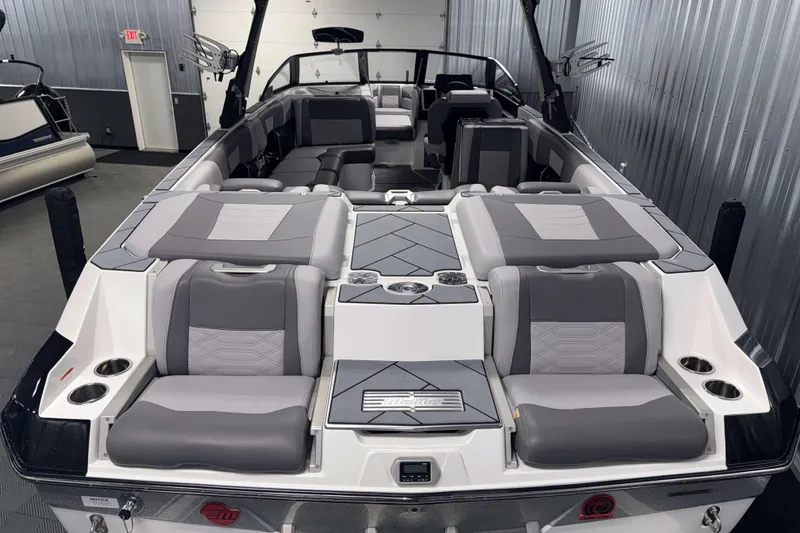 Slide: The Image of 2022 Malibu Wakesetter 25 LSV boat interior with gray seating and modern design. - 2