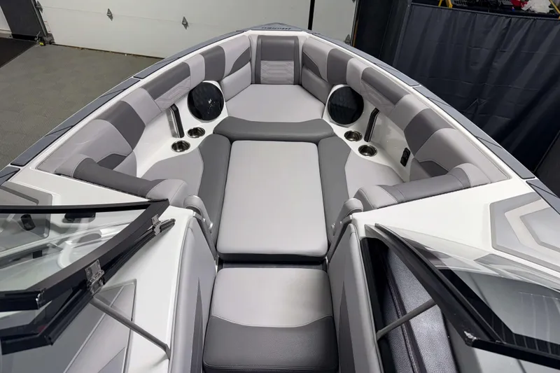 Slide: The Image of 2022 Malibu Wakesetter 25 LSV interior with gray seating and cup holders. - 21