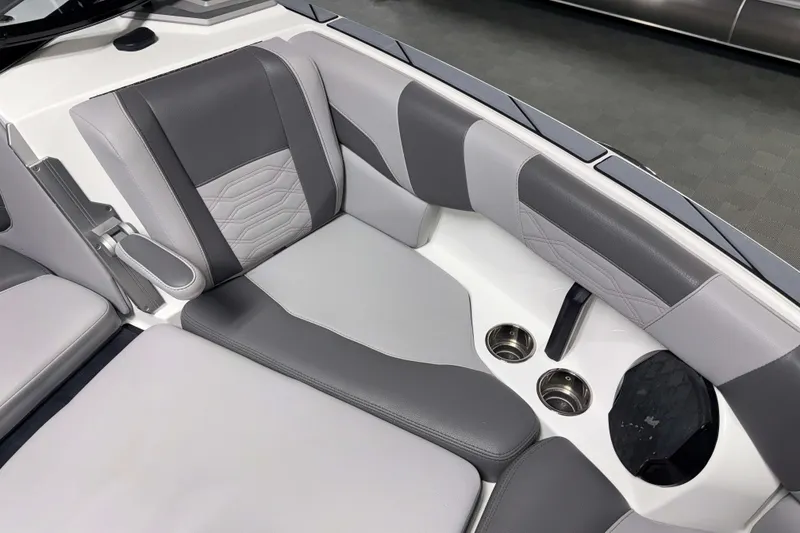 Slide: The Image of 2022 Malibu Wakesetter 25 LSV interior with gray seating and cup holders. - 22