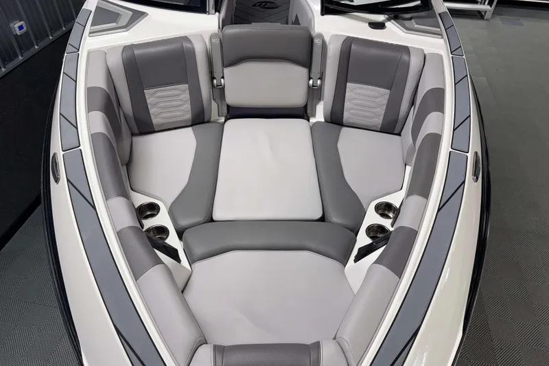 Slide: The Image of 2022 Malibu Wakesetter 25 LSV boat interior with gray and white cushioned seating. - 24