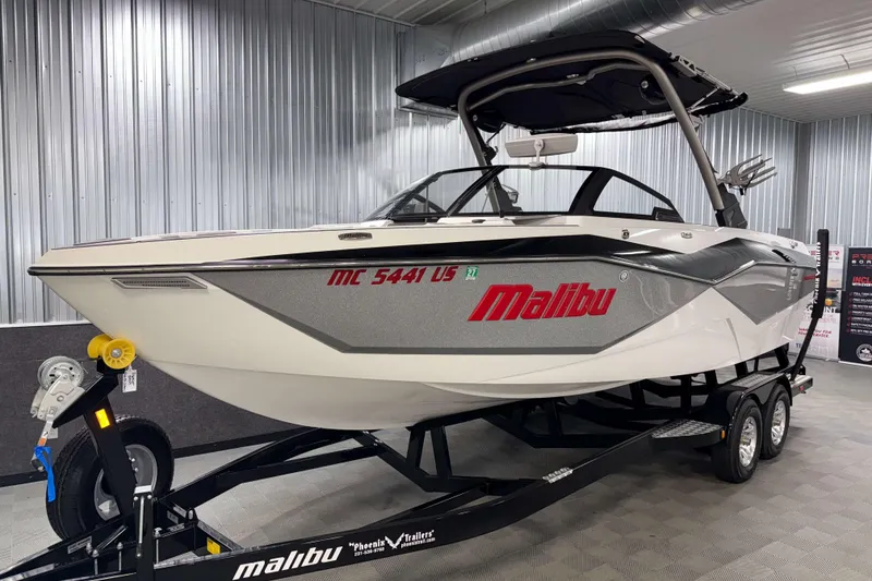 Slide: The Image of 2022 Malibu Wakesetter 25 LSV boat on trailer in showroom. - 28