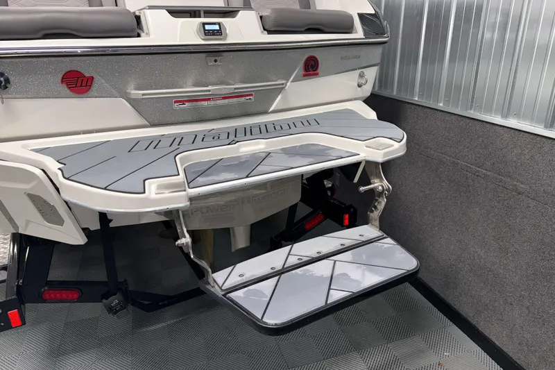 Slide: The Image of 2022 Malibu Wakesetter 25 LSV swim platform with sleek design in a showroom. - 32