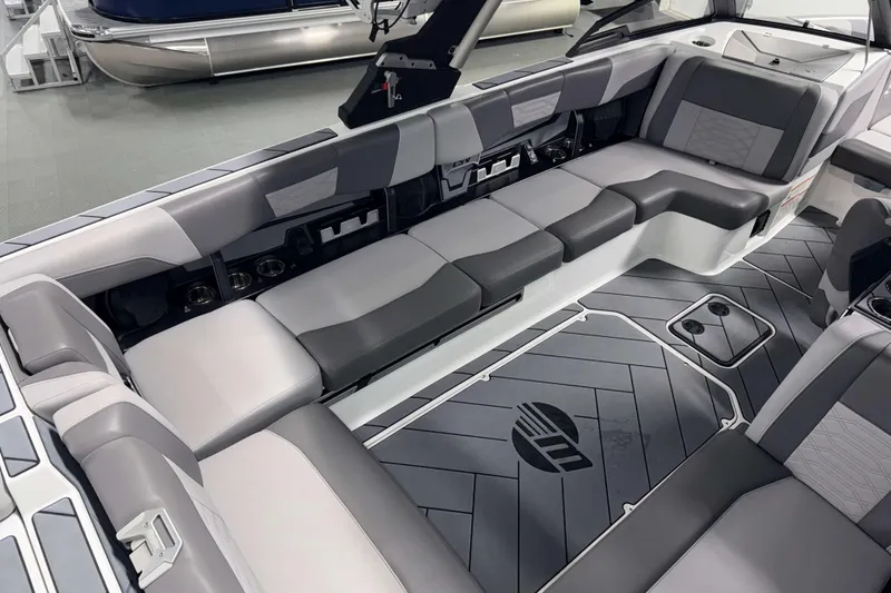 Slide: The Image of 2022 Malibu Wakesetter 25 LSV interior with gray seating and stylish flooring. - 6