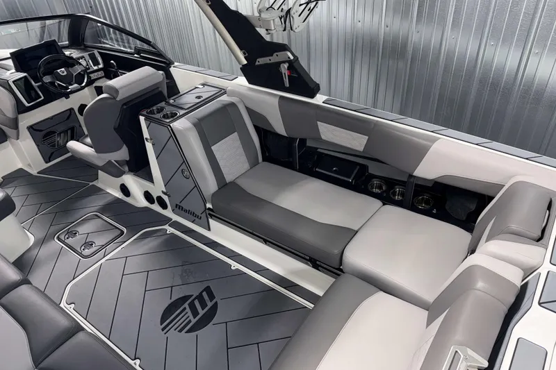 Slide: The Image of 2022 Malibu Wakesetter 25 LSV interior with sleek seating and modern dashboard design. - 7