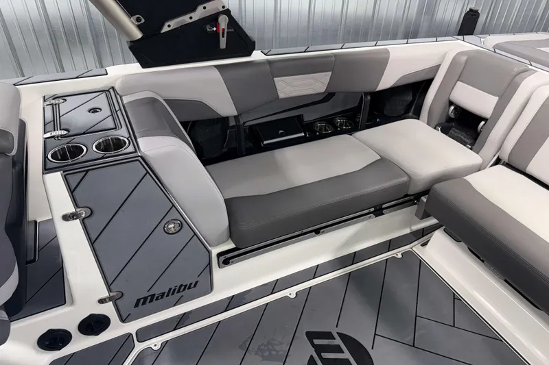 Slide: The Image of 2022 Malibu Wakesetter 25 LSV interior with gray seating and cup holders. - 9