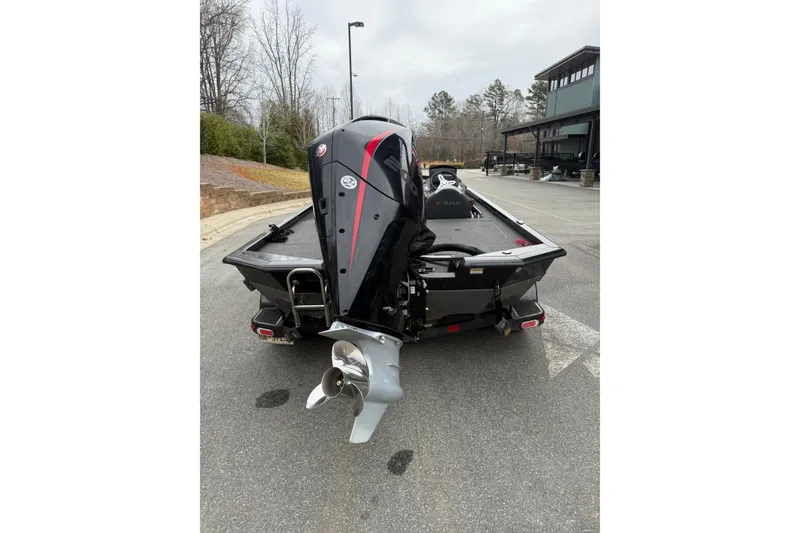 Slide: The Image of 2021 Vexus AVX2080 boat with powerful outboard motor, parked outdoors. - 11