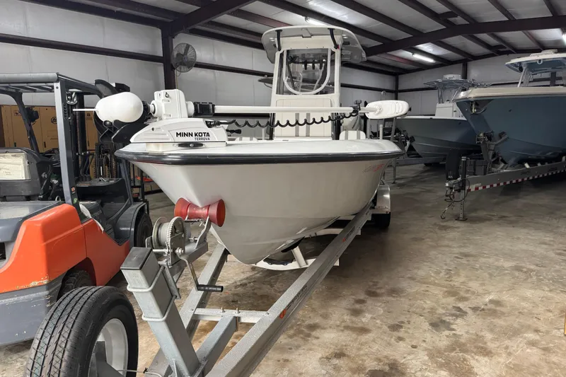 The Image of 2023 Contender 25 Bay boat on trailer in storage facility. - 0
