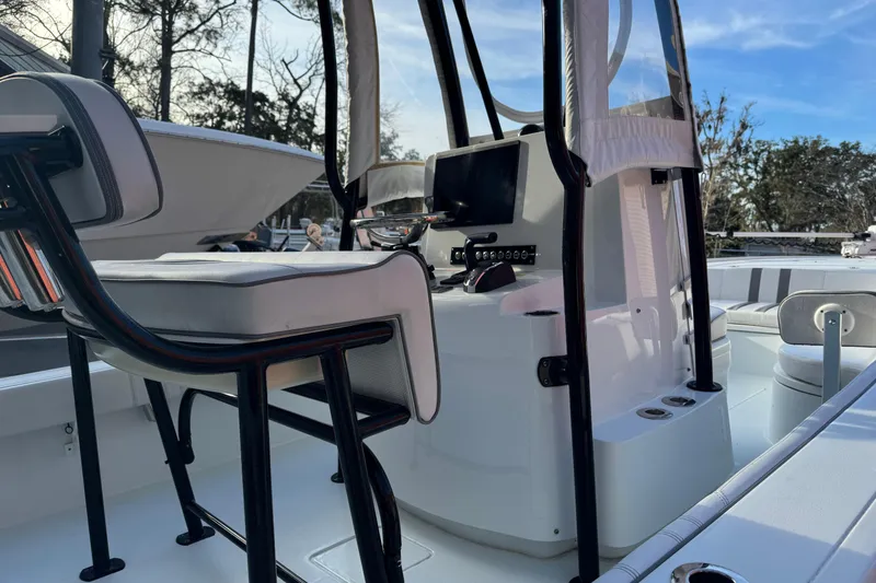 Slide: The Image of 2023 Contender 25 Bay boat interior with seating and control panel. - 14