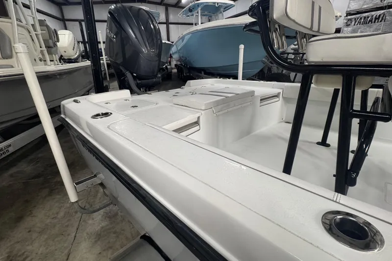 Slide: The Image of 2023 Contender 25 Bay boat interior with seating and Yamaha outboard motor. - 29