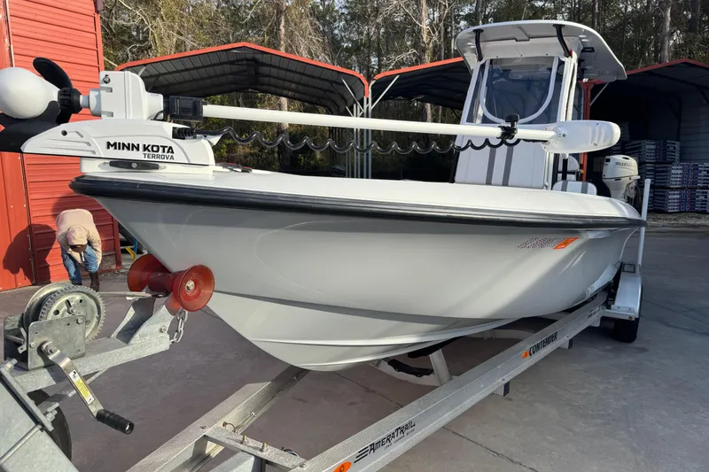 Slide: The Image of 2023 Contender 25 Bay boat on trailer with Minn Kota Terrova motor. - 3