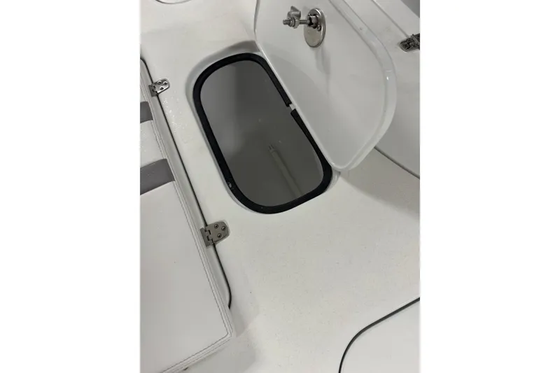 Slide: The Image of Open storage compartment on 2023 Contender 25 Bay boat deck. - 32