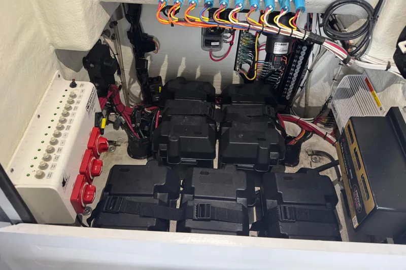 Slide: The Image of Electrical system of a 2023 Contender 25 Bay boat with batteries and wiring. - 35