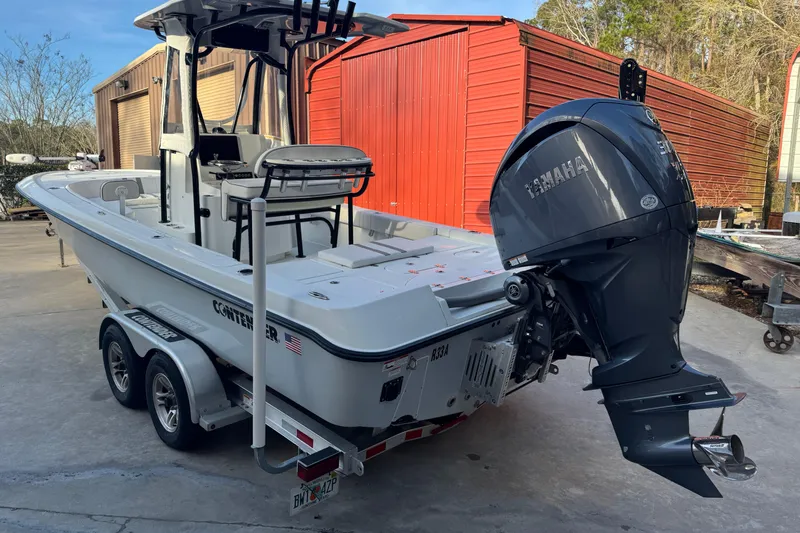 Slide: The Image of 2023 Contender 25 Bay boat with Yamaha outboard motor on a trailer. - 5
