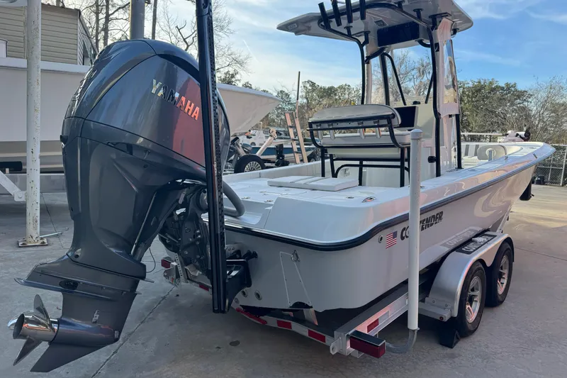 Slide: The Image of 2023 Contender 25 Bay boat with Yamaha outboard engine on trailer. - 6