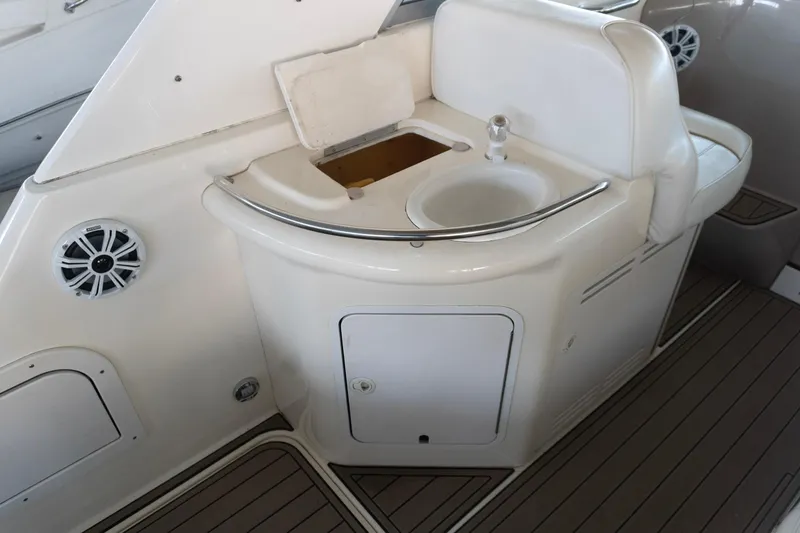 Slide: The Image of 1998 Sea Ray Sundancer 330 boat interior with sink and storage area. - 10