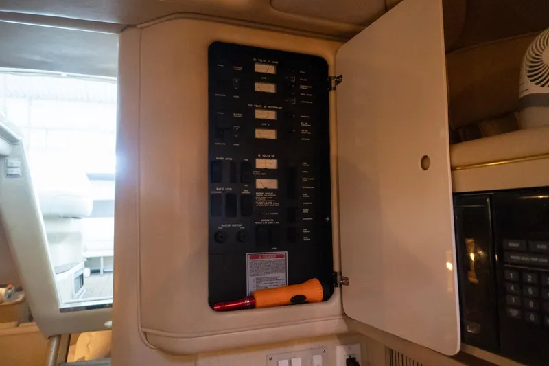 Slide: The Image of Electrical panel inside a 1998 Sea Ray Sundancer 330 boat cabin. - 21