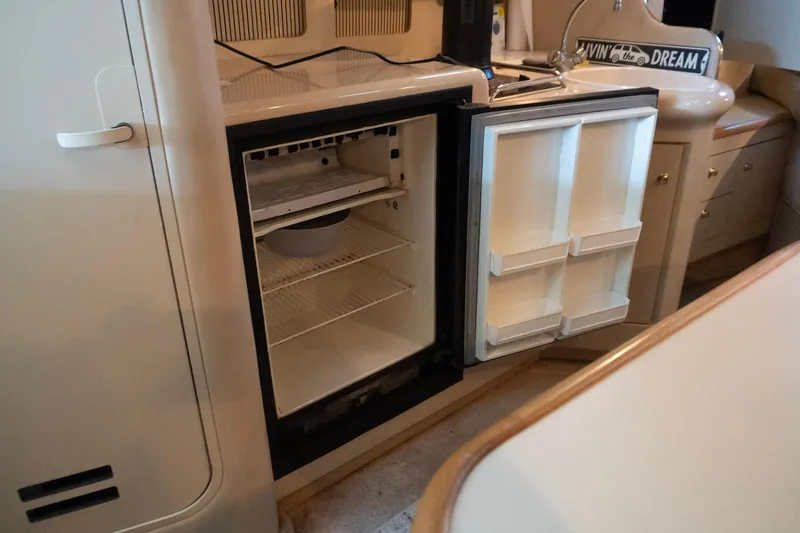Slide: The Image of Open refrigerator inside 1998 Sea Ray Sundancer 330 yacht kitchen area. - 22