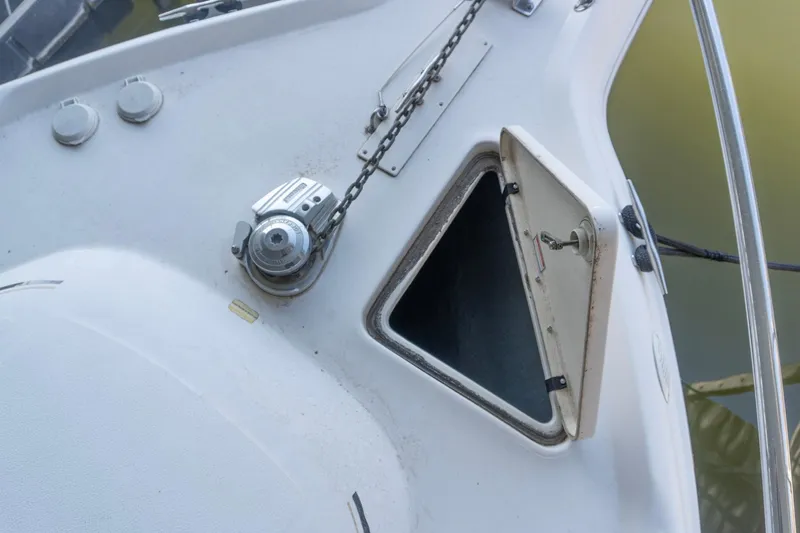 Slide: The Image of Anchor locker and windlass on 1998 Sea Ray Sundancer 330 boat deck. - 35