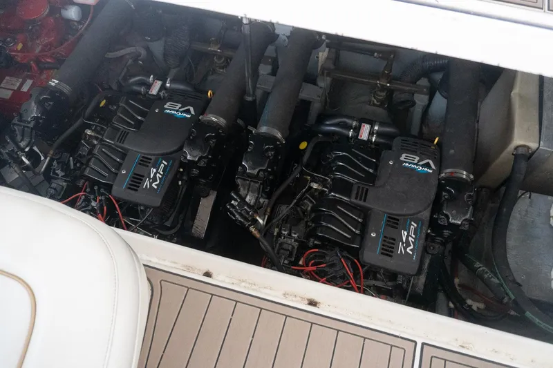 Slide: The Image of Engine compartment of a 1998 Sea Ray Sundancer 330 with twin MerCruiser 7.4L MPI engines. - 38