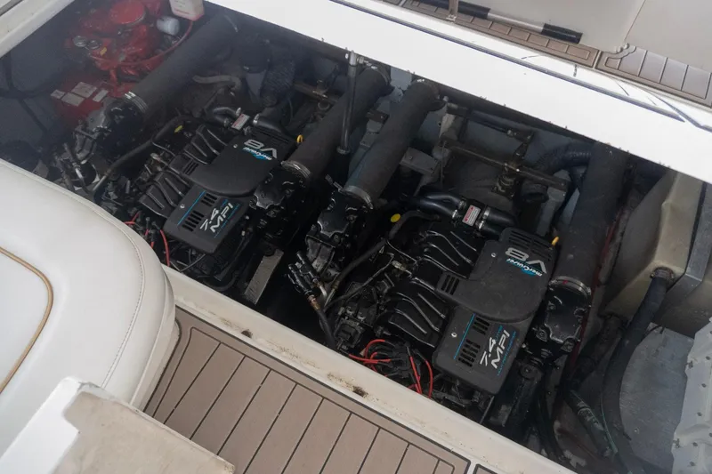 Slide: The Image of Engine compartment of 1998 Sea Ray Sundancer 330 with twin V8 engines. - 39