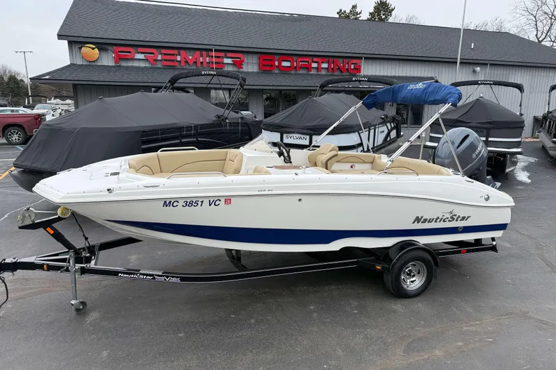 The Image of 2020 NauticStar 203 SC boat on trailer at Premier Boating dealership. - 1