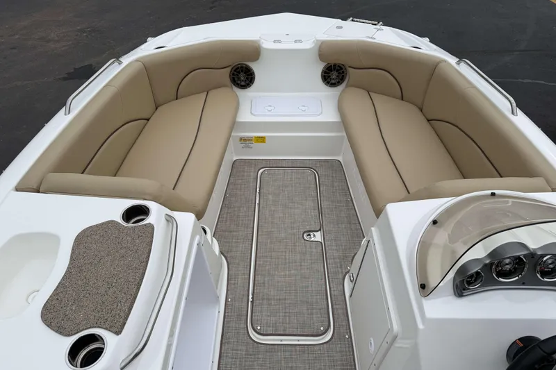 Slide: The Image of 2020 NauticStar 203 SC boat interior with beige seating and dashboard view. - 10