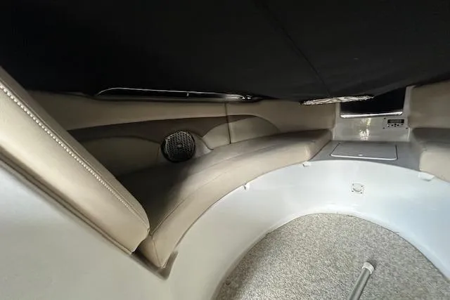 Slide: The Image of 2007 Chaparral Sunesta 254 interior cabin with cushioned seating and speaker. - 10