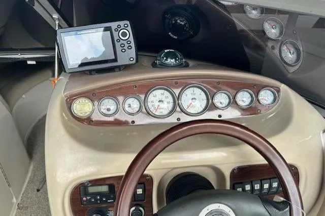 Slide: The Image of 2007 Chaparral Sunesta 254 dashboard with gauges and navigation system. - 12