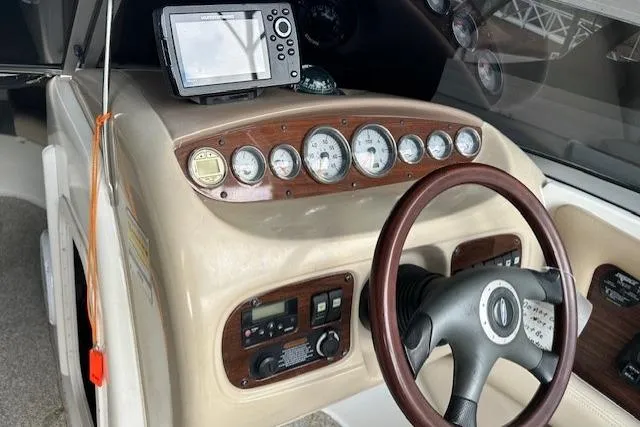 Slide: The Image of 2007 Chaparral Sunesta 254 dashboard with gauges and steering wheel. - 13