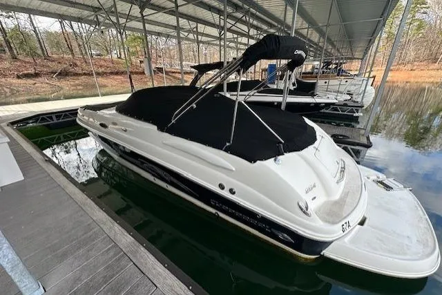 Slide: The Image of 2007 Chaparral Sunesta 254 boat docked under a covered marina. - 4