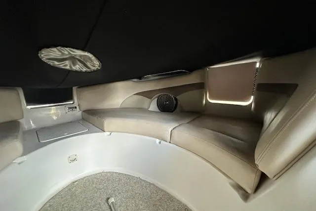 Slide: The Image of 2007 Chaparral Sunesta 254 interior cabin with cushioned seating and speaker system. - 9