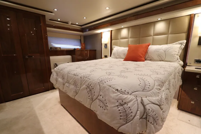 Slide: The Image of Luxurious bedroom interior of 2017 Viking 80 Enclosed Bridge yacht with elegant bedding. - 13