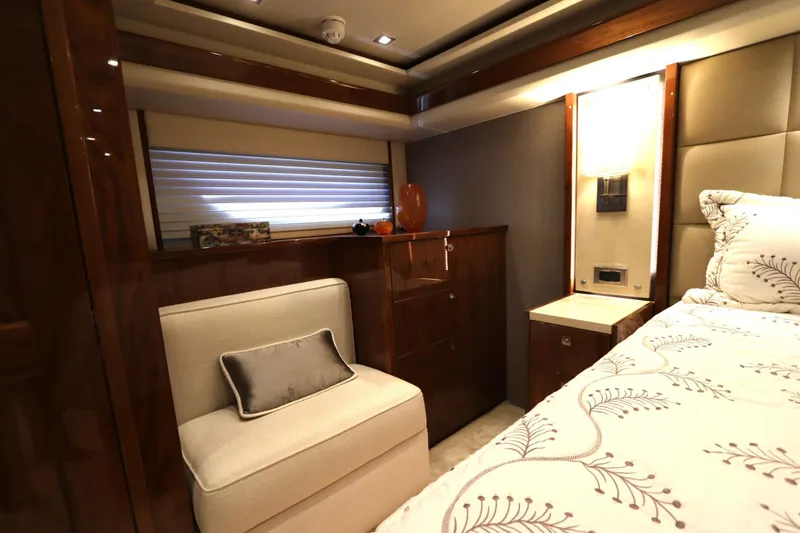 Slide: The Image of Luxurious interior of 2017 Viking 80 Enclosed Bridge yacht with elegant furnishings. - 14