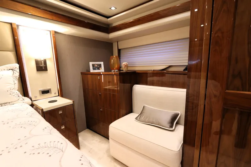Slide: The Image of Luxurious interior of 2017 Viking 80 Enclosed Bridge yacht with elegant wood finishes. - 15