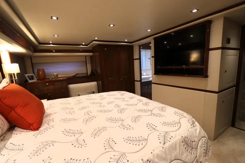 Slide: The Image of Luxurious bedroom interior of 2017 Viking 80 Enclosed Bridge yacht with elegant decor. - 17