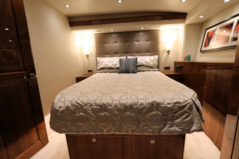 Slide: The Image of Luxurious bedroom interior of 2017 Viking 80 Enclosed Bridge yacht with elegant bedding. - 23